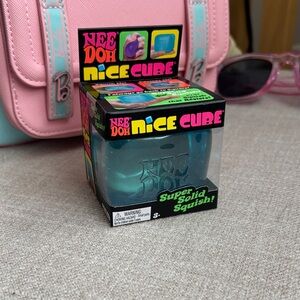 NeeDoh Nice Cube – Teal Clear Squish Toy | Popular Translucent Blue Super Squis